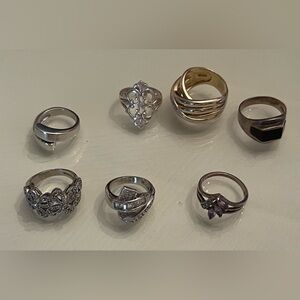 7 Women's Ring Set. I don’t have any information on these or the stones & age